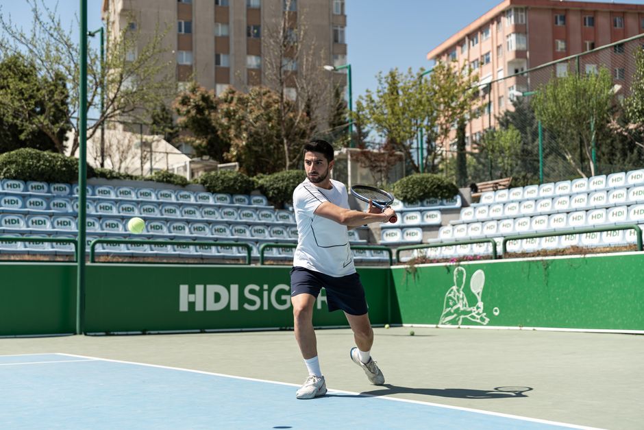 Player executing a soft shot representing pickleball dink technique